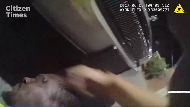 Video still of Asheville Police Officer Hickman beating Johnnie Rush